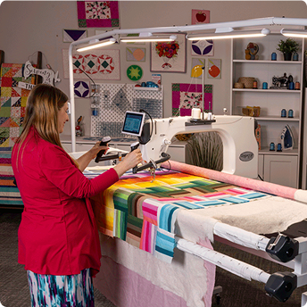 Quilter adjusting the Finesse Aura light bar control box
