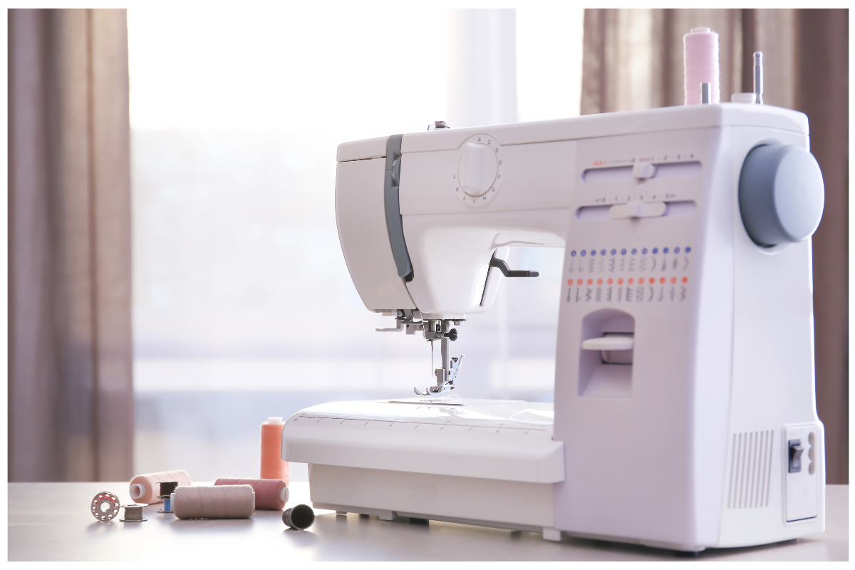 A sewing machine on a table
Description automatically generated