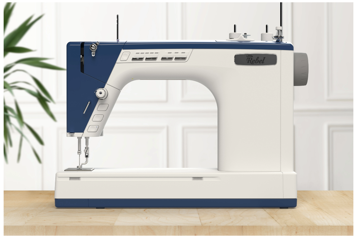 A sewing machine on a table
Description automatically generated